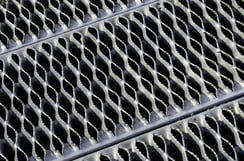 Industrial abstract Symmetrical safety ramp of aluminum with small ridges, like teeth, to provide traction for pedestrians.jpeg Industrial abstract Symmetrical safety ramp of aluminum with small ridges, like teeth, to provide traction for pedestrians.jpeg